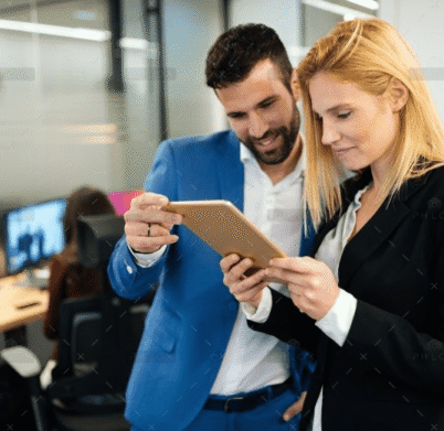 businesspeople-discussing-while-using-digital-WFGVC3X@2x
